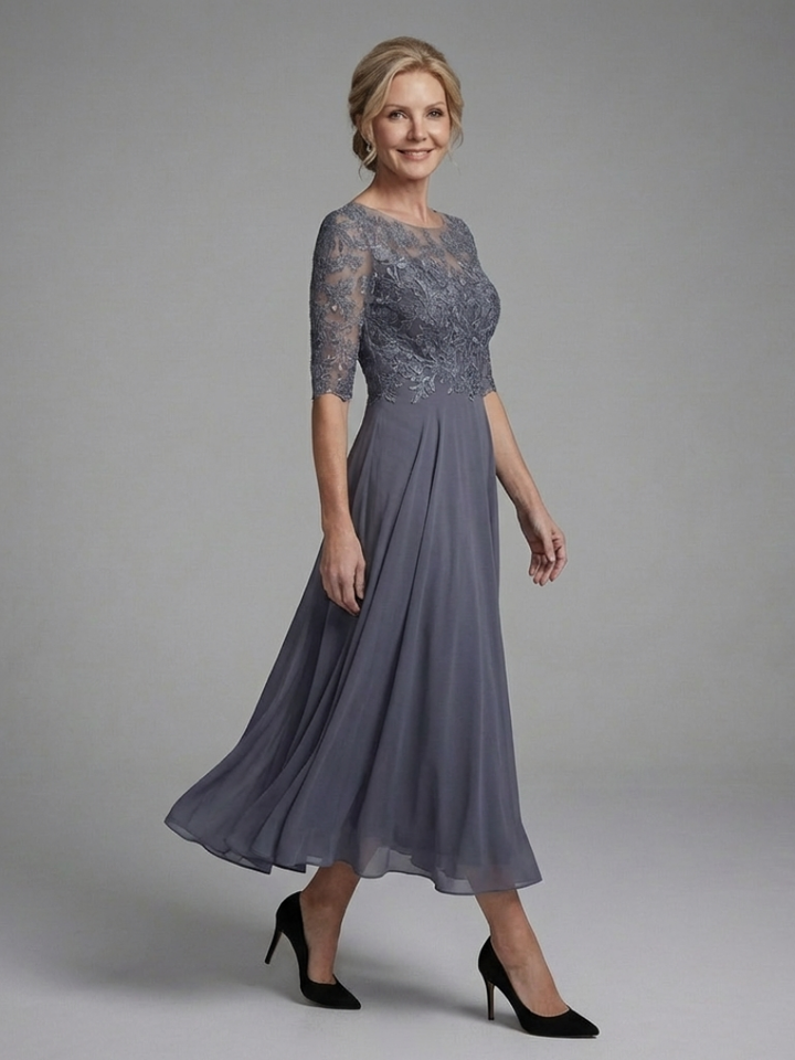 Sophisticated women's midi party dress featuring sheer sleeves and a unique designed top.