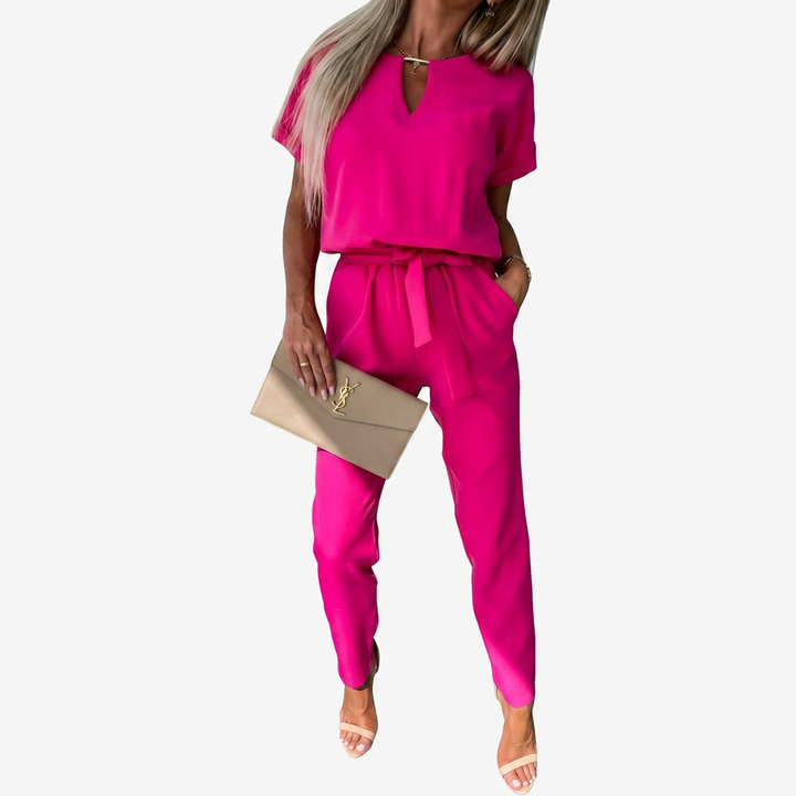 Modern women's short-sleeve jumpsuit with stylish keyhole neck and comfortable tapered leg design.
