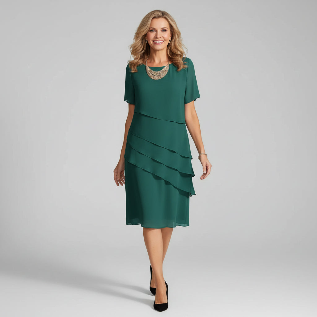 Chic women's tiered midi dress with short sleeves. A flowy, elegant summer dress, comfortable for any party or occasion.