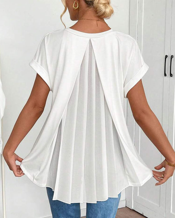 Elegant women's short sleeve top with stylish pleated back detail, perfect for casual or dressed-up summer outfits.