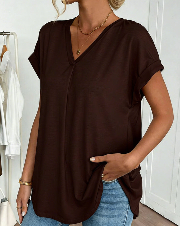 Women's elegant short sleeve top with a comfortable crew neck and unique pleated back, great for summer style.