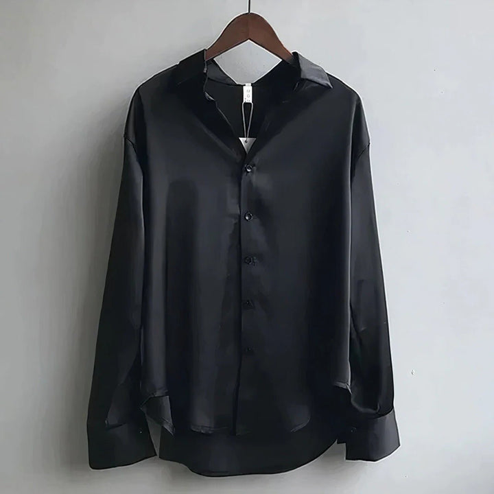 White silky satin long sleeve blouse for women. Versatile button-down top for casual chic or evening wear.