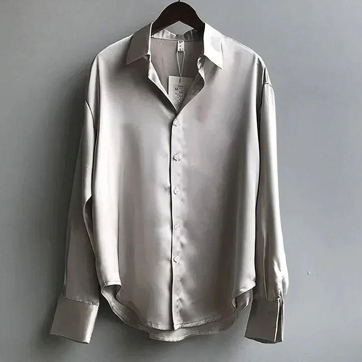 Black silky button-down long sleeve blouse. Sophisticated women's top for elegant office and evening occasions.