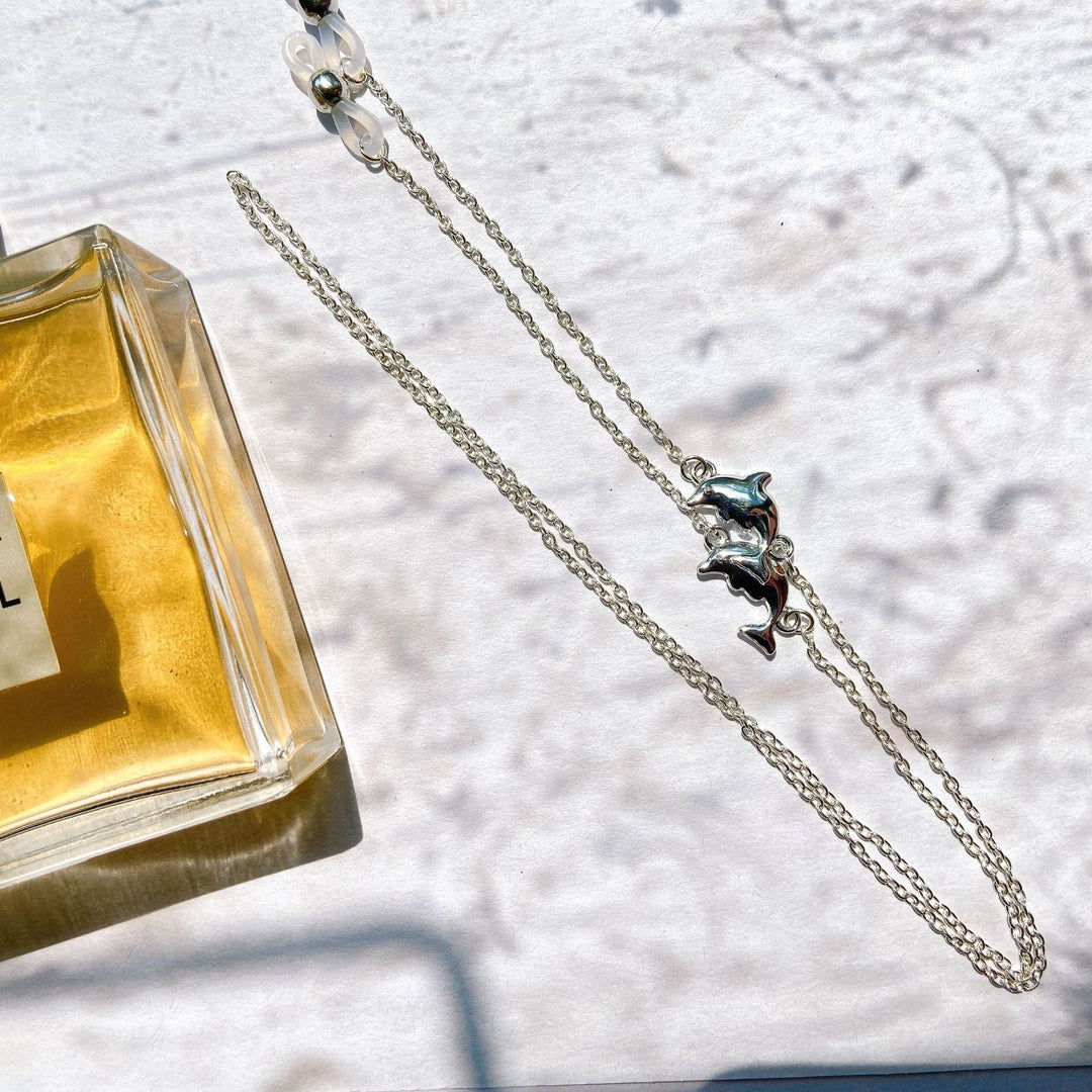 Stylish women's filigree peace sign pendant necklace, featuring an elegant sparkling silver design.