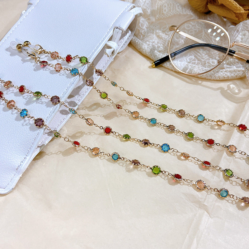Detailed filigree glitter necklace for women, featuring a silver-plated finish and an array of colorful sparkling crystals.