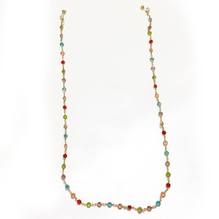 Women's sparkling silver-plated filigree necklace with glitter and an array of colorful crystals. Elegant jewelry.