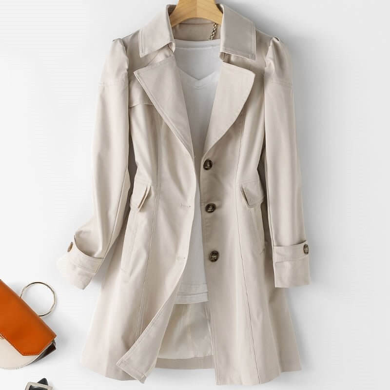 Stylish single-breasted women's trench coat with belt. A versatile long jacket for workwear & casual elegance.