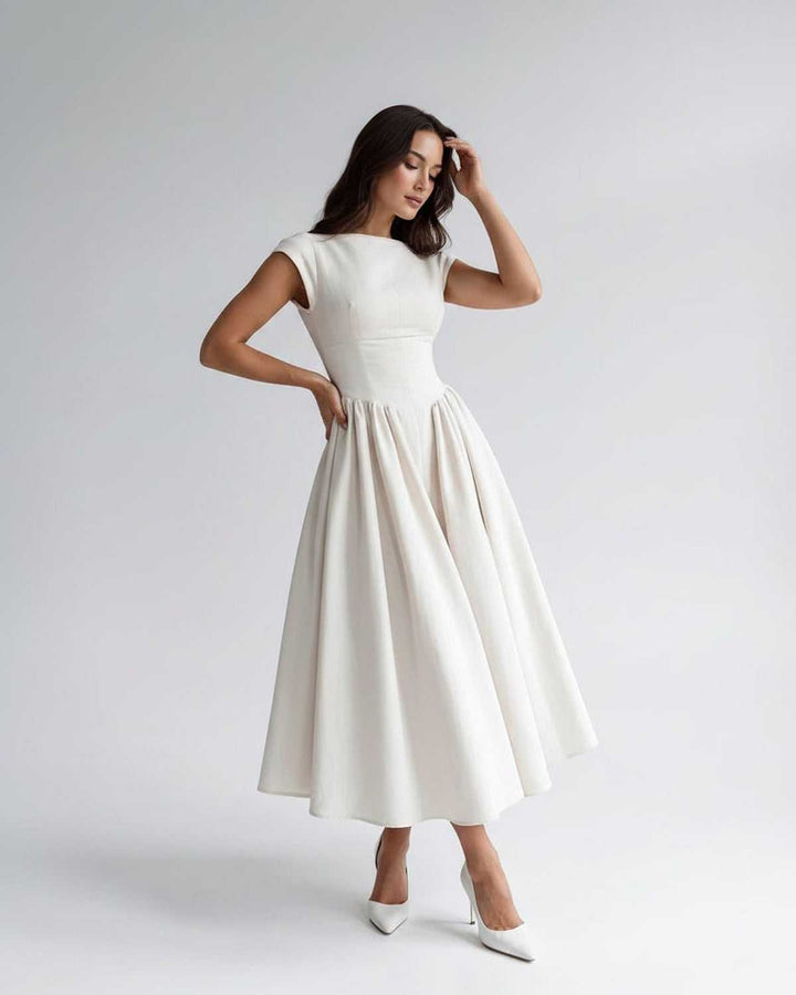Modern women's sleeveless A-line midi dress, versatile, perfect for day to evening wear.