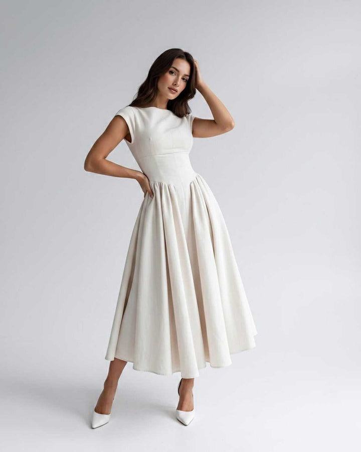 Flattering women's A-line midi dress, sleeveless, flared skirt, gathered waist, round neck.