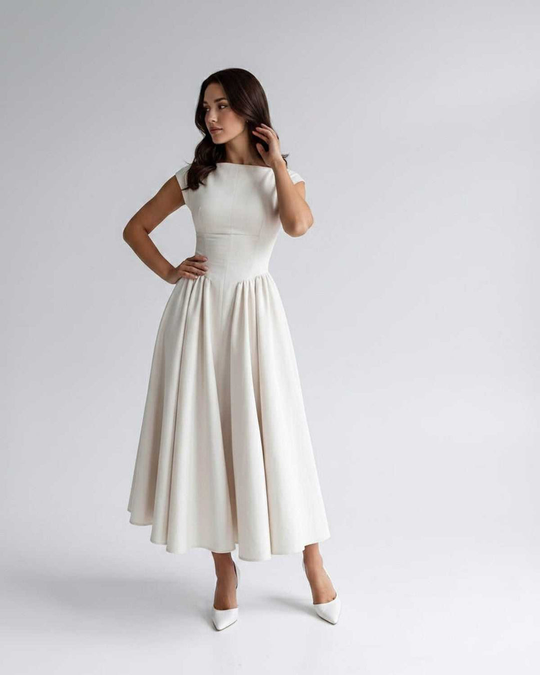 Sleek women's sleeveless A-line midi dress, elegant, flared, perfect for special occasions.