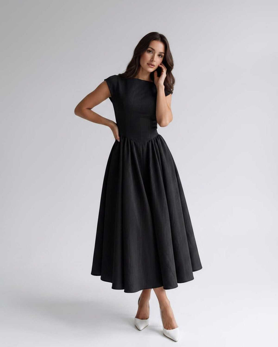 High-quality women's sleeveless A-line midi dress, flared, gathered waist, durable fabric.