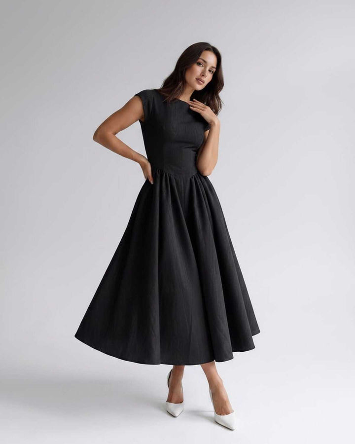 Autumn style women's midi dress, sleeveless, A-line, flared, with an elegant gathered waist.