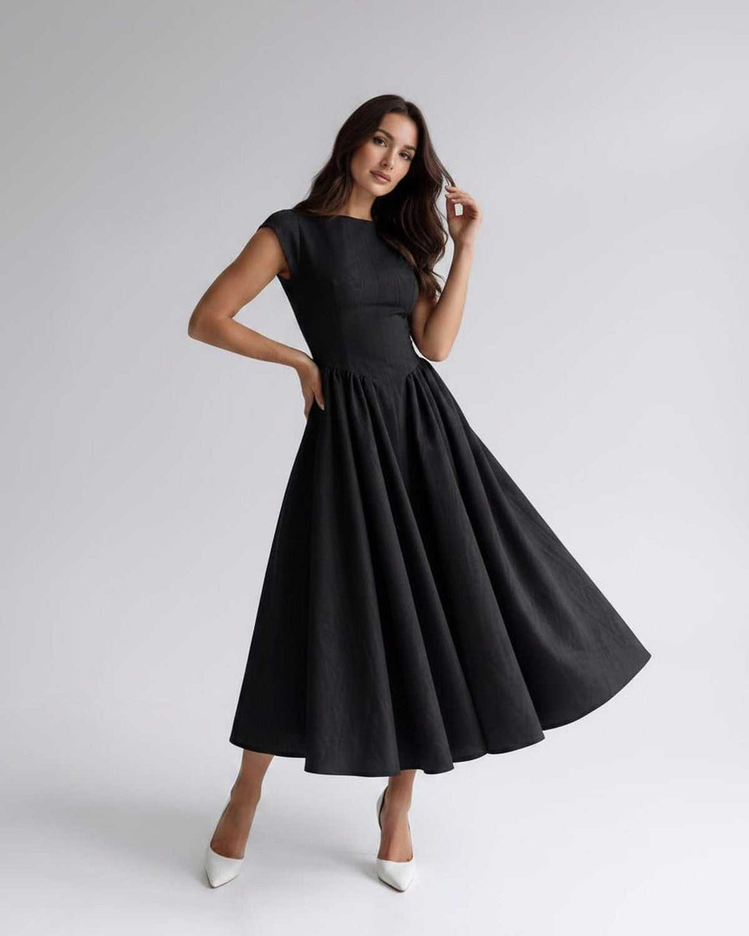 Women's elegant formal dress, sleeveless, A-line, flared, midi length, with gathered waist.