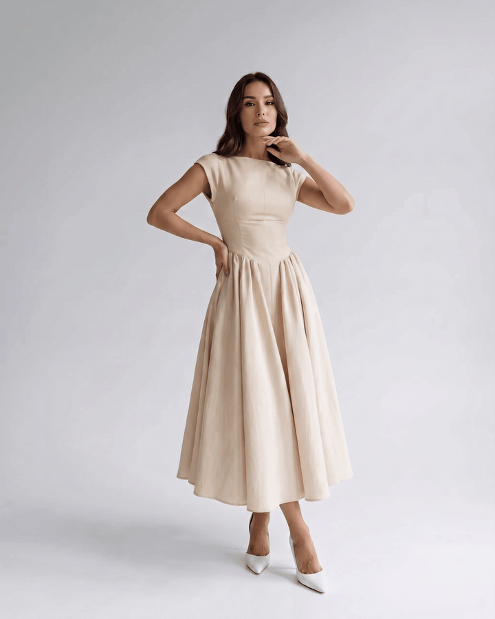 Chic women's sleeveless A-line midi dress, elegant occasion wear, round neck, midi length.