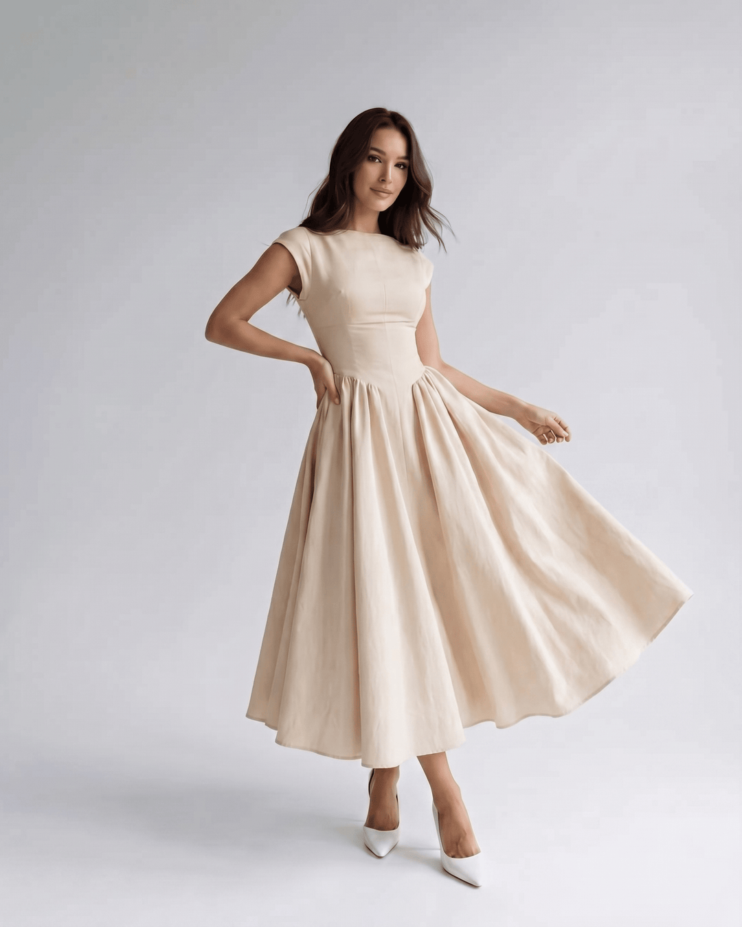 Stylish women's A-line midi dress, sleeveless, flared, with a sophisticated gathered waist.