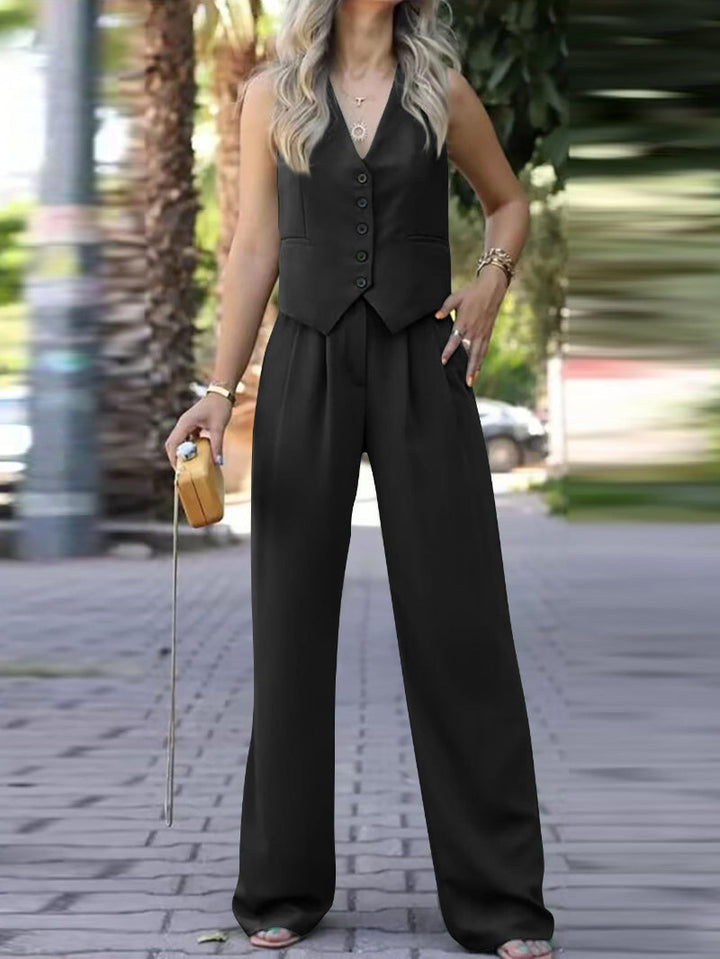 Stylish women's sleeveless blazer and pant set for business casual. An elegant spring summer outfit with a slim fit.