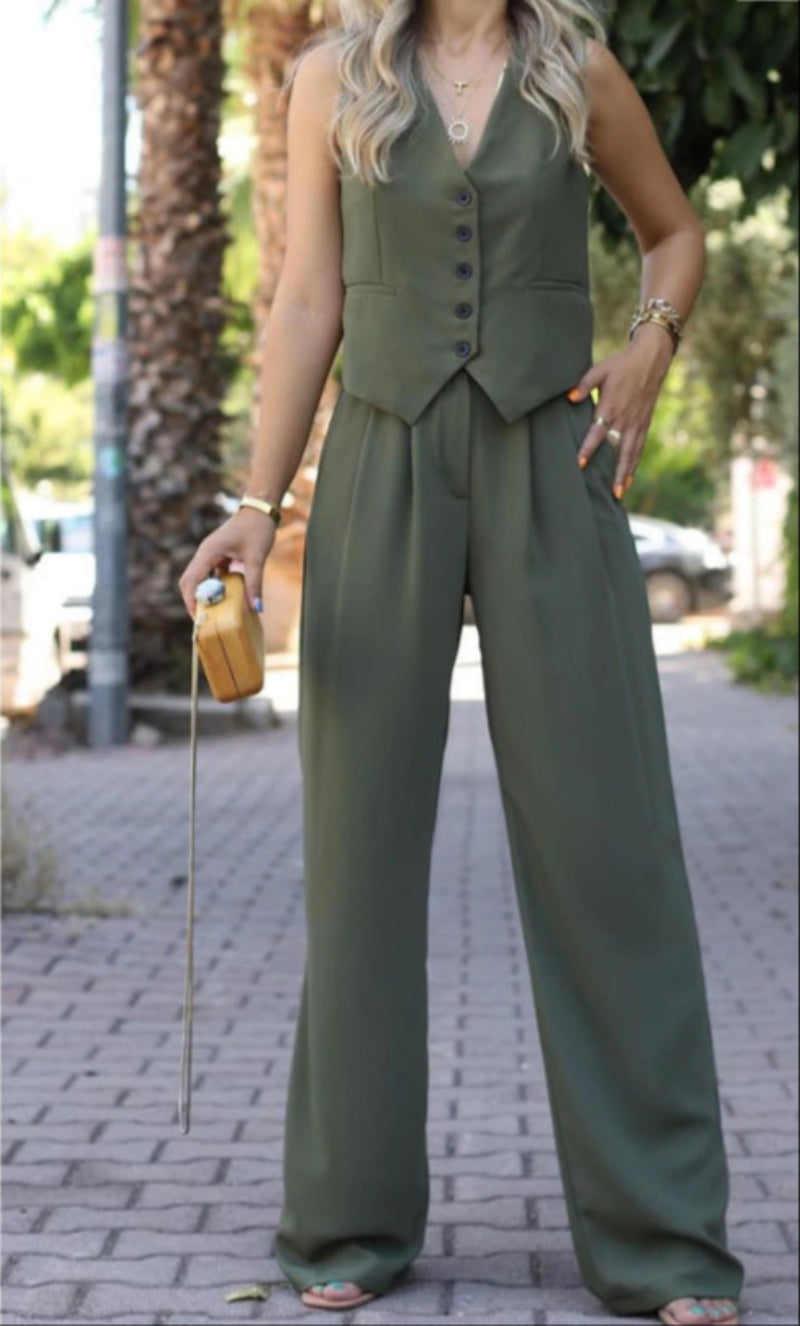 Modern women's chic sleeveless blazer & pant set, offering an elegant slim-fit look for business and fashion.