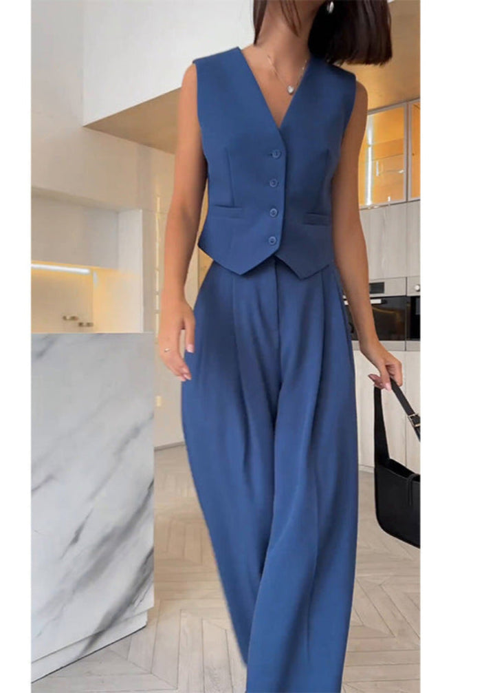 Women's elegant sleeveless blazer & matching pant set. A chic, slim-fit outfit for business casual or events.