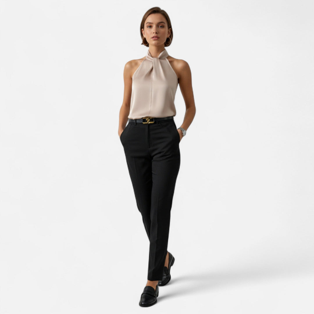 Elegant women's sleeveless blouse with a stylish twisted neck, perfect for chic office or evening wear.