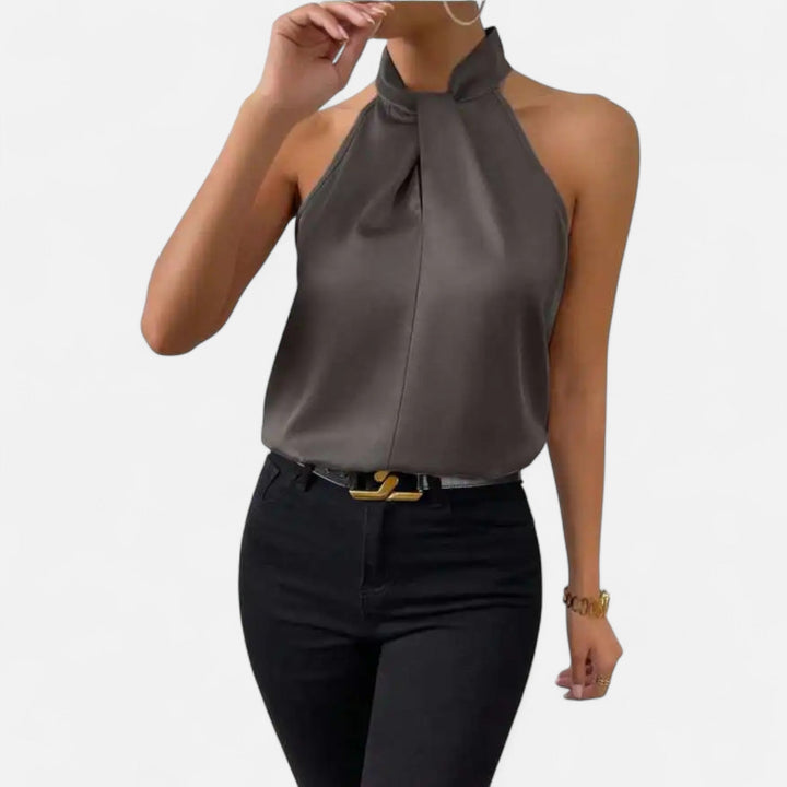 Versatile women's sleeveless blouse with a flattering twisted neckline, great for layering or stand-alone style.