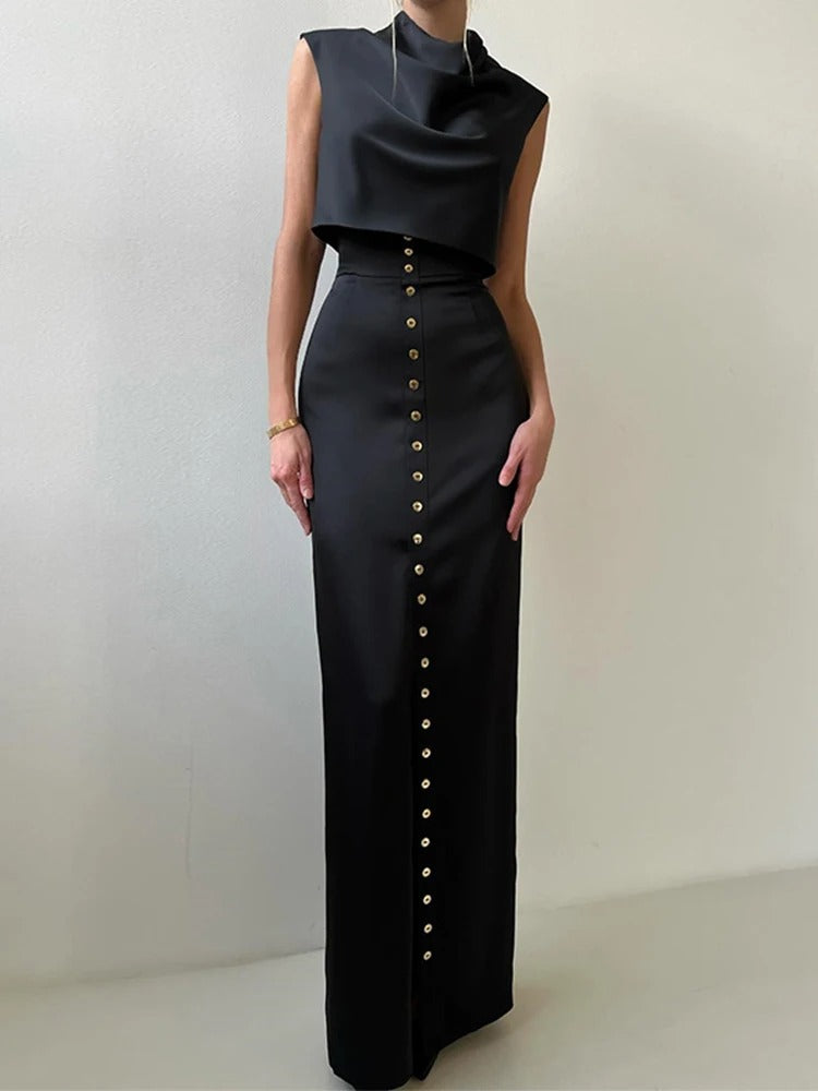 Sophisticated women's sleeveless button-up two-piece set. Features a cropped top & elegant maxi skirt for summer occasions.