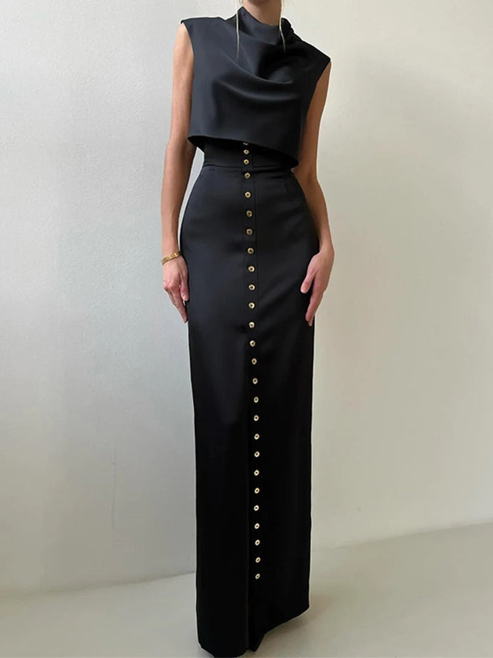 Sophisticated women's sleeveless button-up two-piece set. Features a cropped top & elegant maxi skirt for summer occasions.