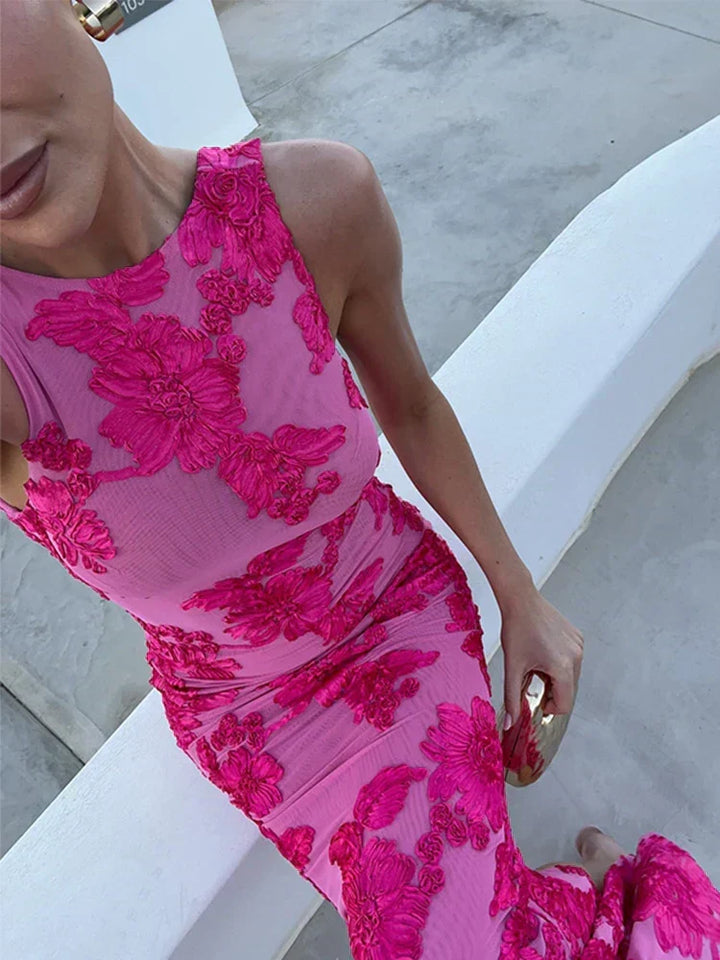 Women's elegant sleeveless floral maxi dress, a long fitted dress for summer events and occasion wear.