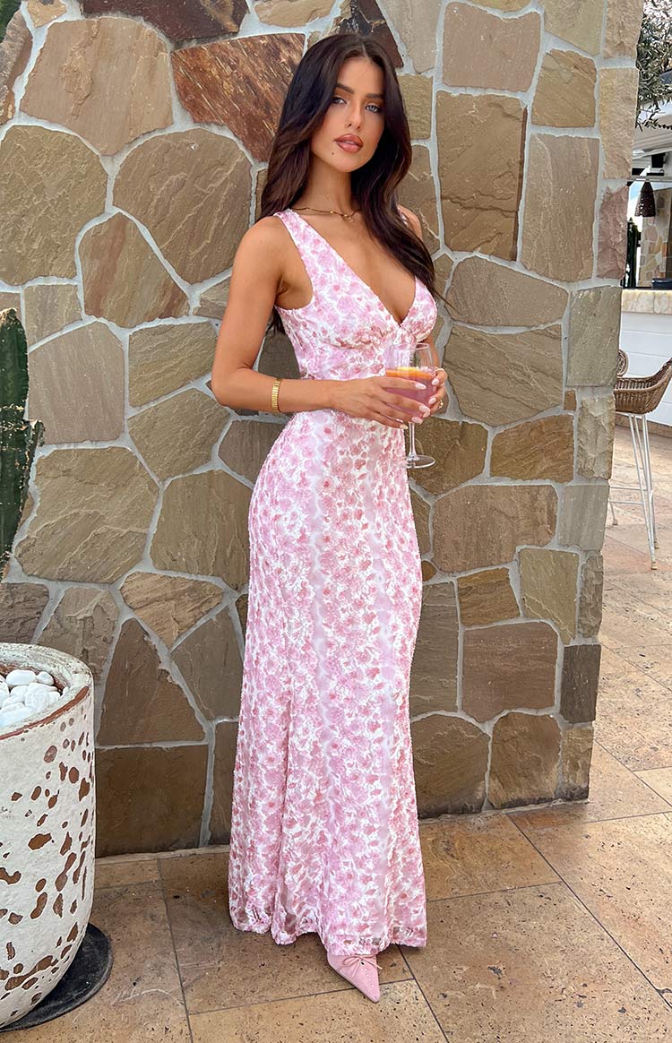 Exquisite sleeveless floral maxi wedding dress, an elegant special occasion gown.