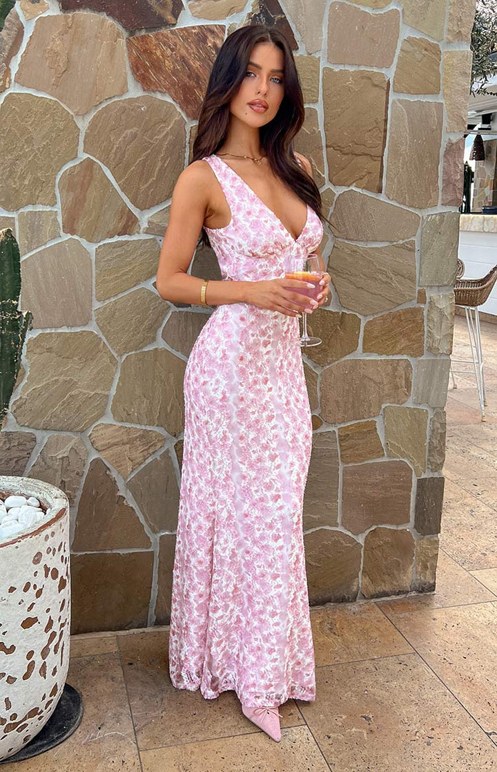 Exquisite sleeveless floral maxi wedding dress, an elegant special occasion gown.
