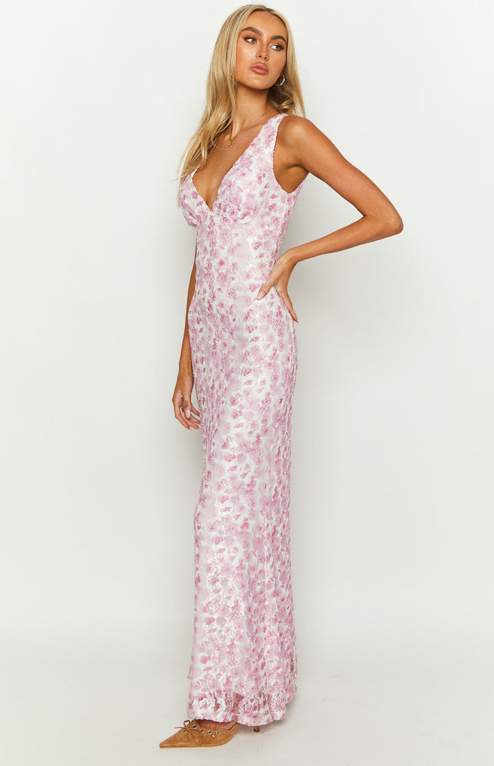 Close-up of the delicate floral pattern on a sleeveless women's evening dress.