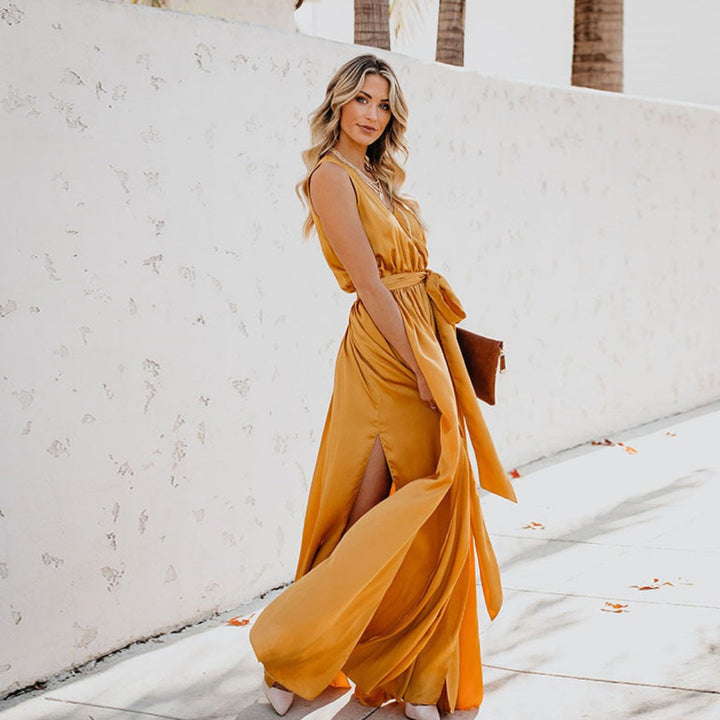 Elegant women's sleeveless maxi dress with a flattering belt and stylish side split, perfect for evening or occasion wear.