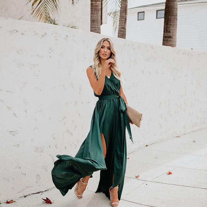 Long women's sleeveless dress, elegant design with a comfortable belted waist and fashionable side split for a flattering fit.