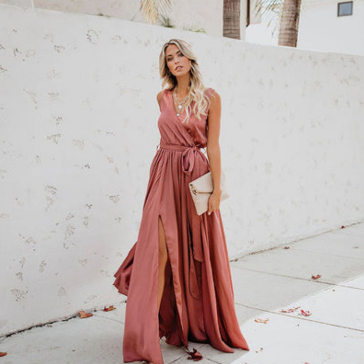 Chic women's occasion wear: a sleeveless maxi dress with a self-tie belt and alluring side split, great for summer evenings.