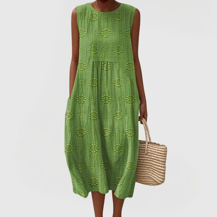 Elegant women's sleeveless summer dress with practical pockets. Perfect for casual wear or vacation.