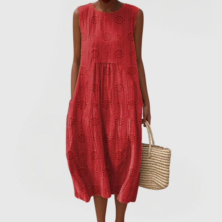 Beautifully embroidered elegant summer dress for women, sleeveless with practical pockets, A-line style.
