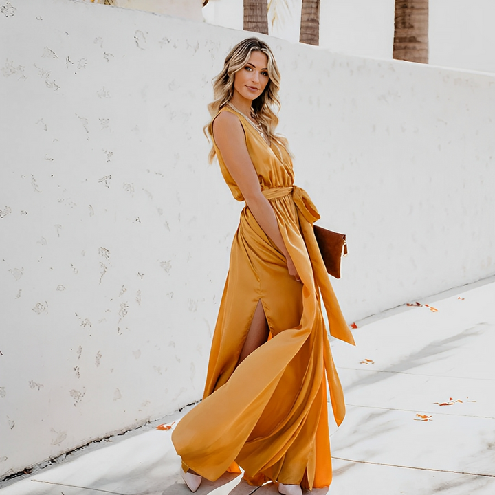 Elegant women's sleeveless V-neck maxi dress with a flattering waist belt, perfect for special occasions & parties.