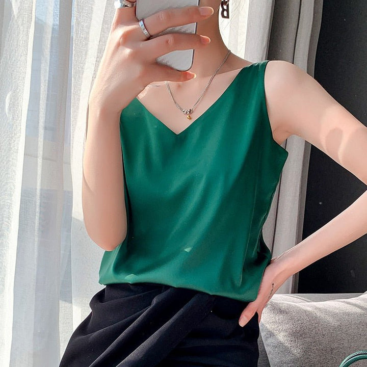Chic women's V-neck sleeveless blouse, featuring a stylish flowy design perfect for warm summer days.