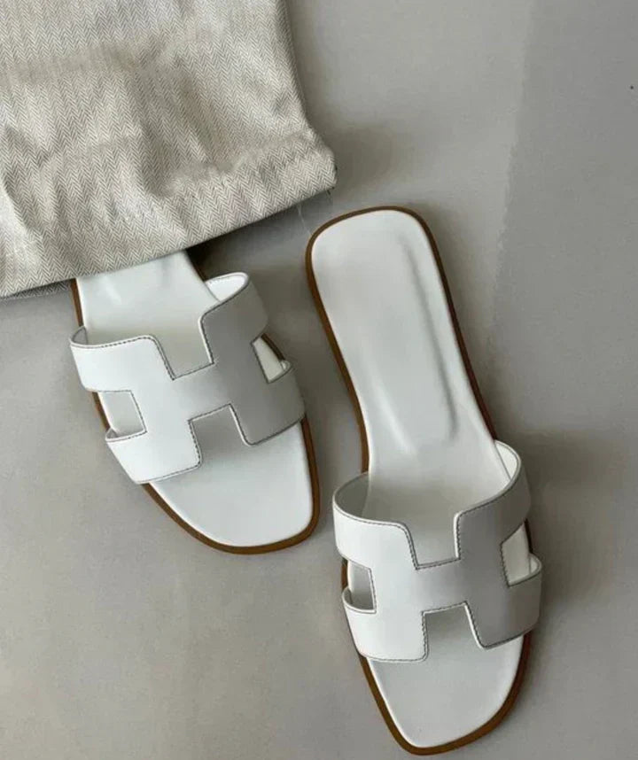 Elegant women's slip-on H-strap sandals with low heel, perfect for summer casual wear.