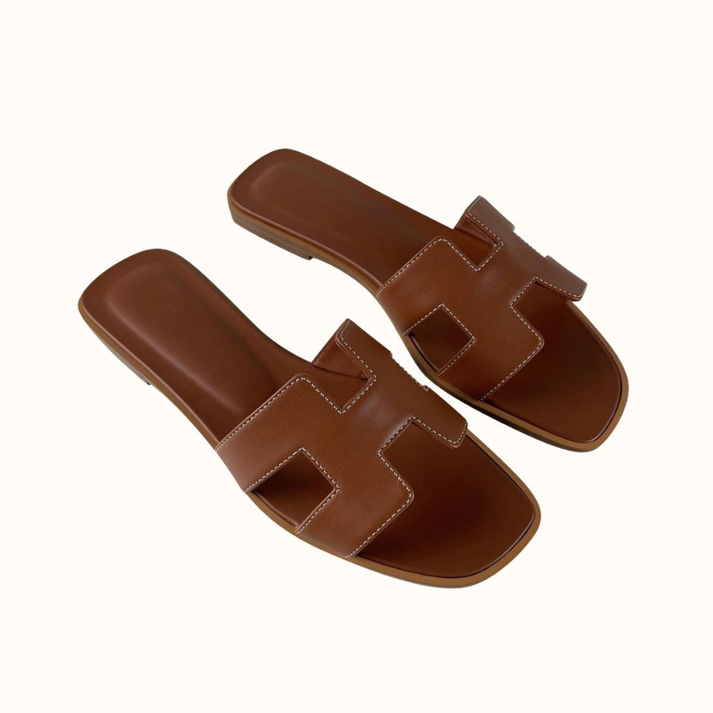 Women's elegant slip-on H-strap low heel sandals for comfortable summer casual fashion.