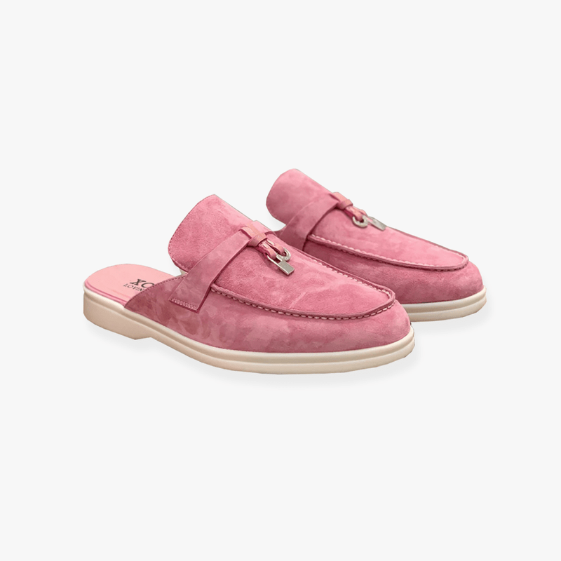 Chic women's backless loafers. Slip-on mule flats offering elegant style and comfortable footwear for versatile outfits.