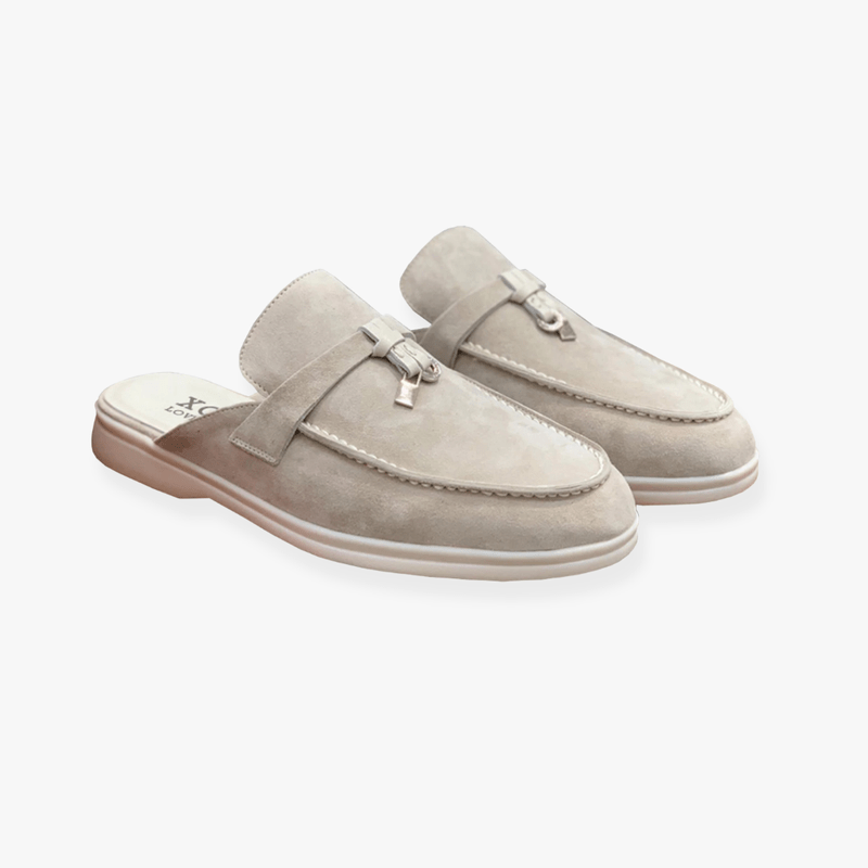 Stylish women's slip-on mule loafers. These elegant flats provide comfort and a sophisticated look for smart casual wear.