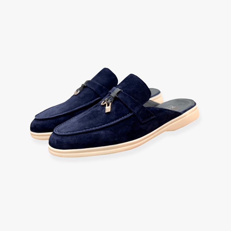 Comfortable women's backless loafers. Elegant slip-on mule flats designed for easy wear and smart casual style.