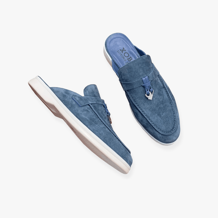 Women's smart casual slip-on mule loafers. Elegant backless flats offering comfort and a versatile chic look.