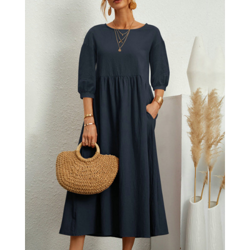 Elegant women's smocked midi dress for summer. Comfortable, flattering & versatile for warm weather.