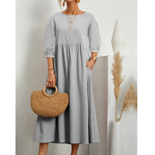 Casual women's smocked midi dress. Elegant sleeveless design, perfect for comfortable summer wear.