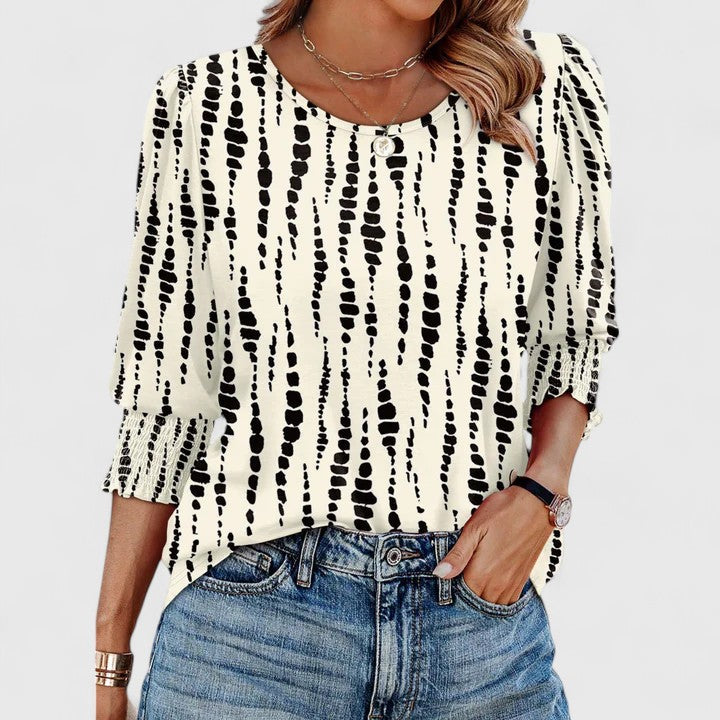 Elegant women's smocked top for versatile summer fashion. Chic blouse with relaxed fit & comfort.