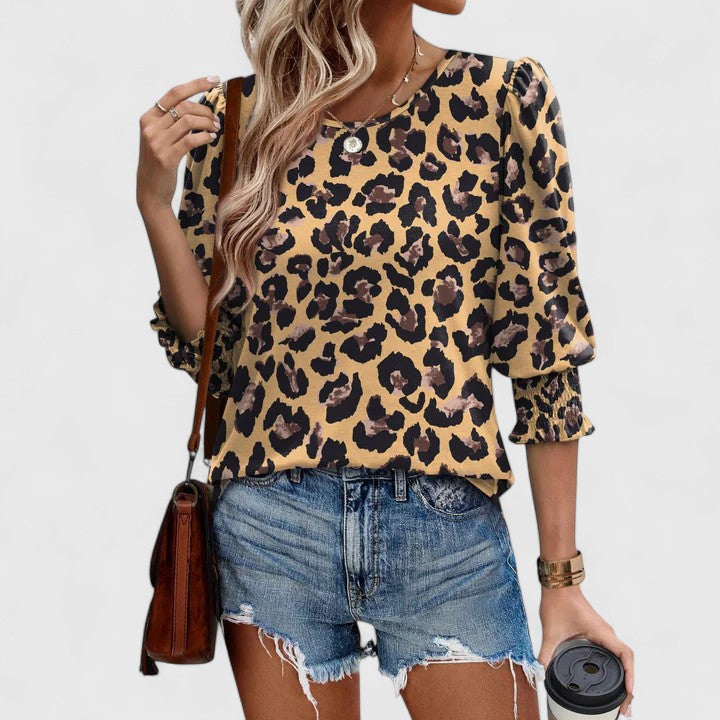 Beautiful women's smocked blouse, offering relaxed fit and elegant comfort for versatile fashion.