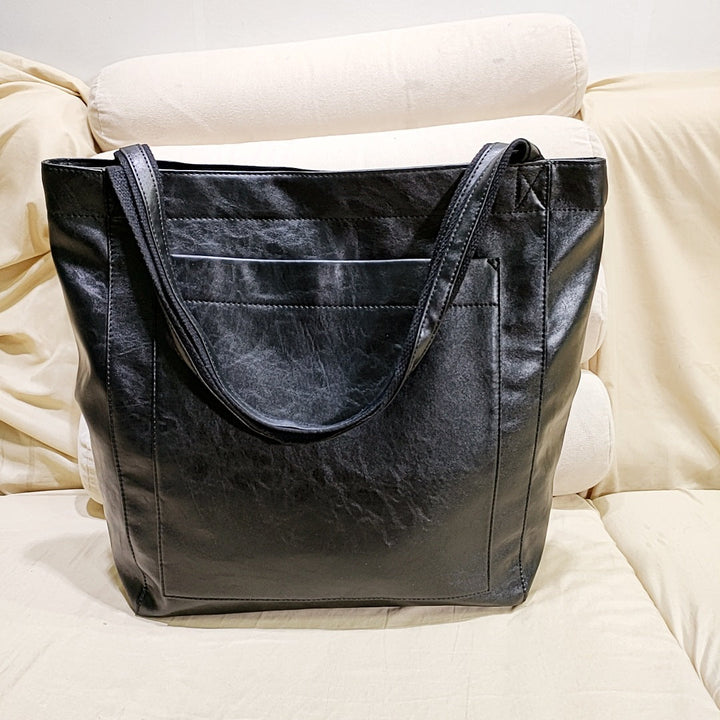 Luxury soft genuine leather women's handbag, an elegant and versatile tote purse, perfect for organized everyday use.