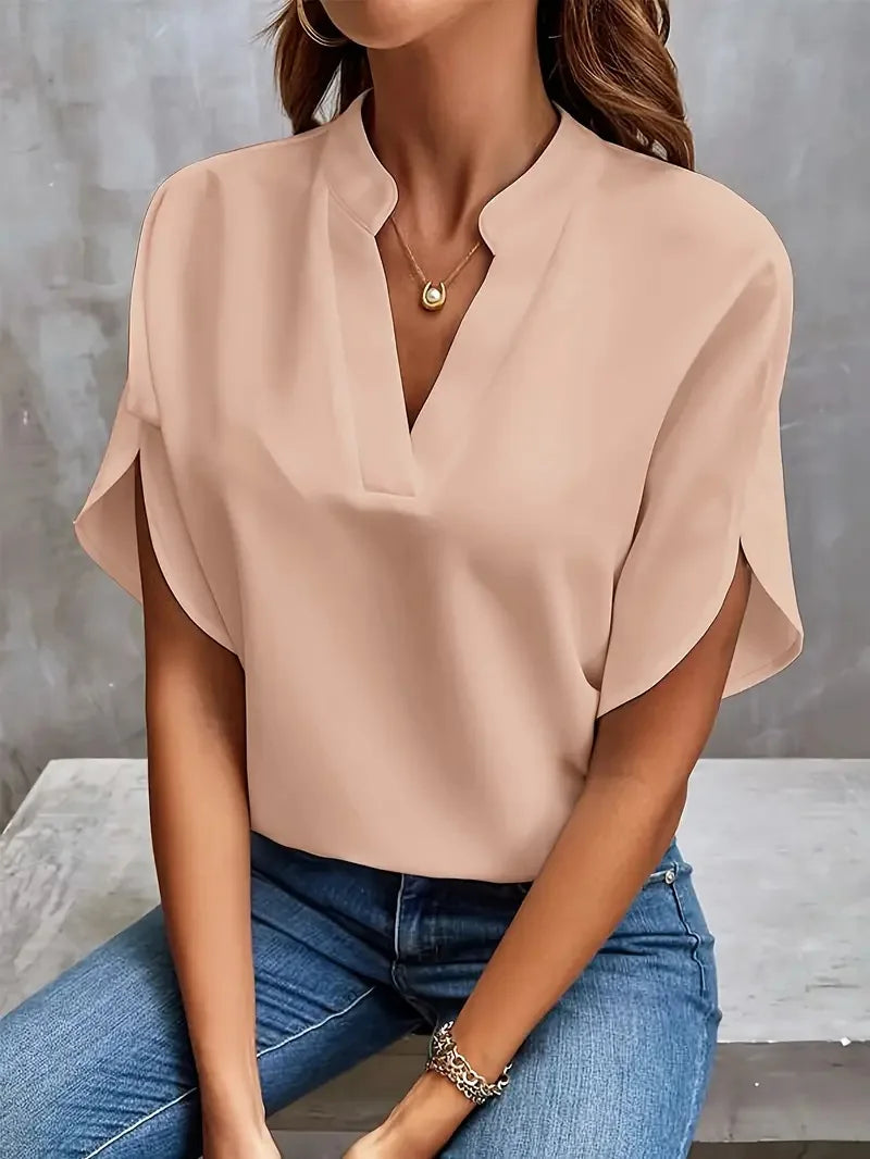 Stylish women's V-neck blouse, soft material, long sleeves. A versatile top for casual or formal wear.