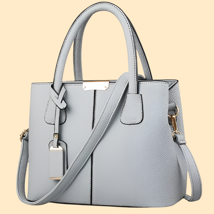 Versatile women's solid leather handbag, an elegant shoulder bag suitable for work, everyday, and fashion.
